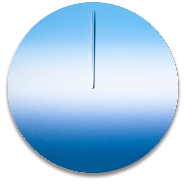 A minimalist wall clock with a large blue dial and a single silver hand, with no numbers or markers on the dial.