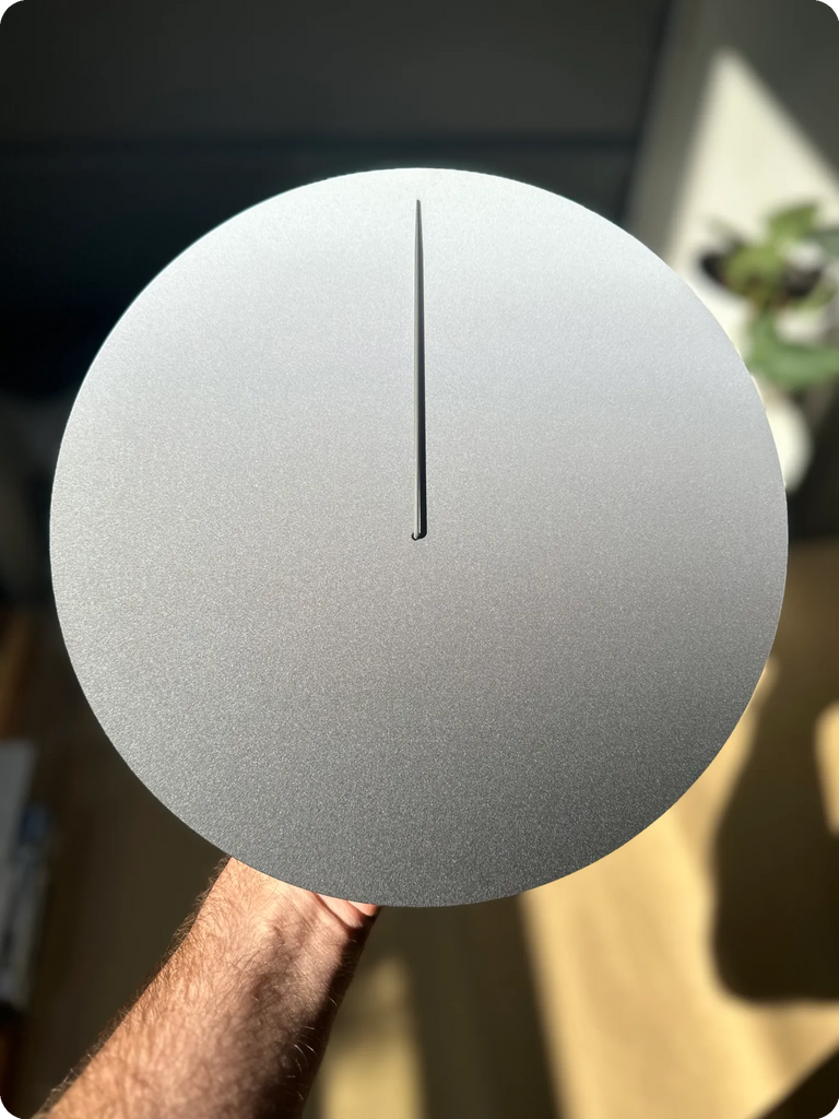 Matte moon held in hand in direct sunlight no filter.