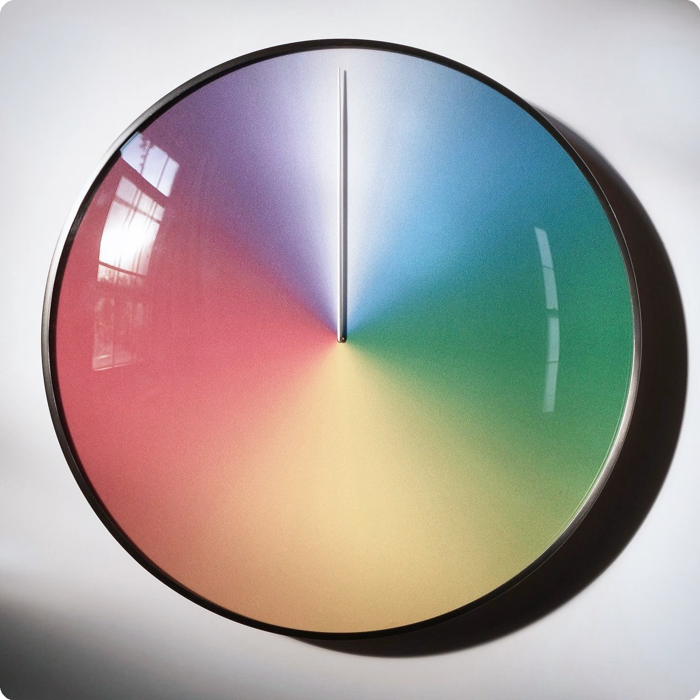 The Present - Year (steel + glass) against a white wall in square format, facing the camera lens.