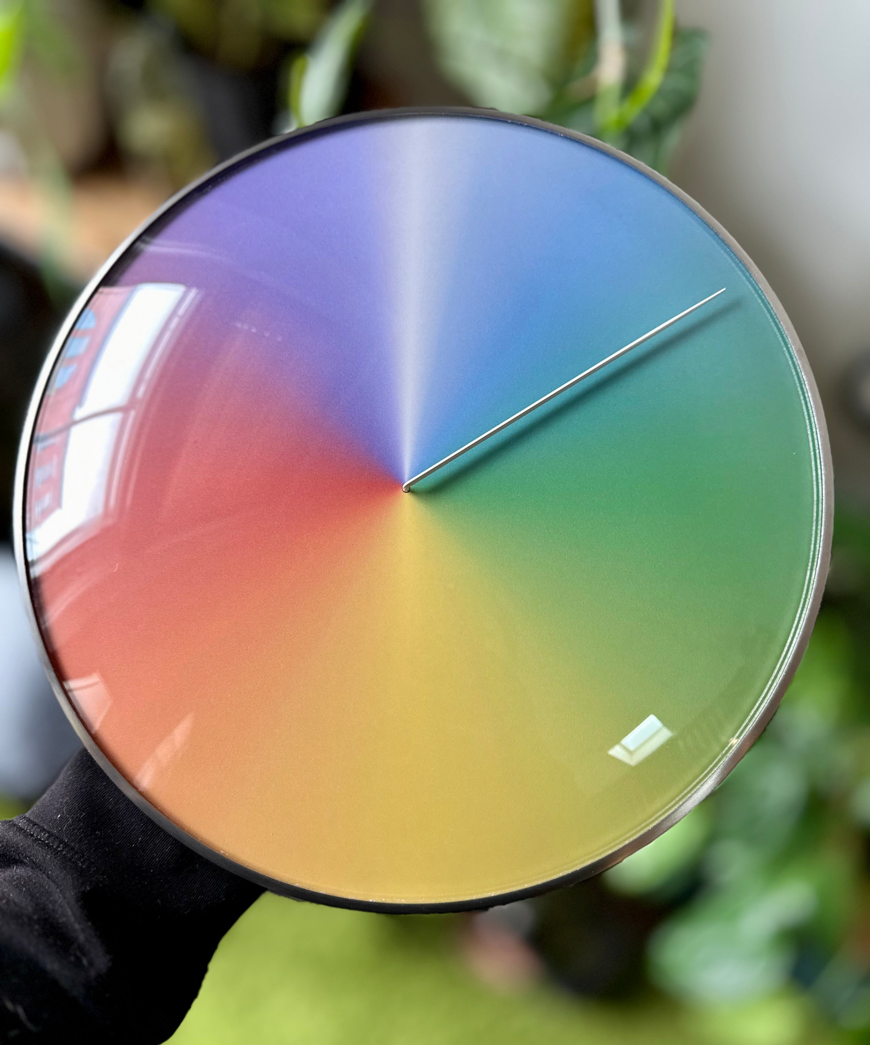 The Present - Year (steel + glass) being held in one hand by the founder to reveal the quality of the final print.